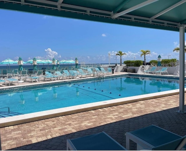 view of swimming pool with a patio