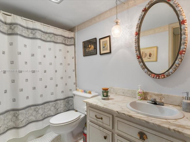 bathroom with tile patterned floors, vanity, and toilet