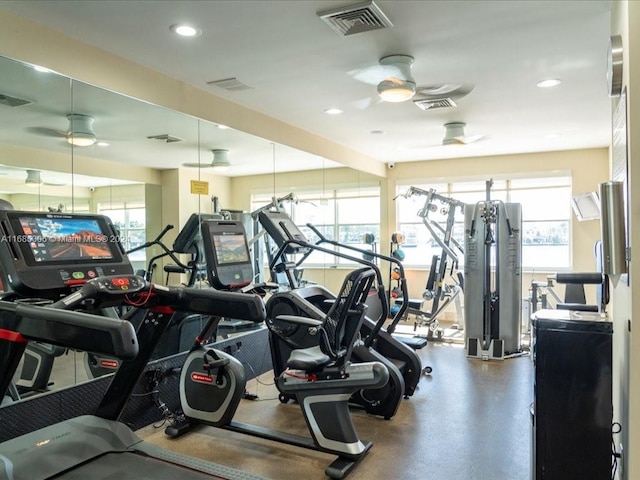 exercise room with ceiling fan and plenty of natural light