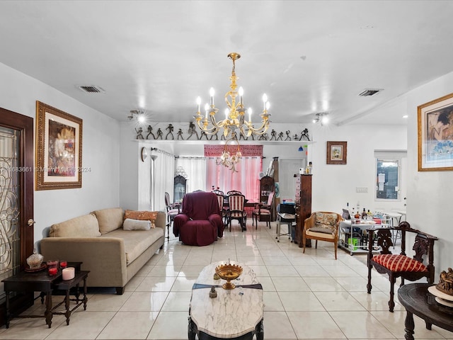 tiled living room with a notable chandelier