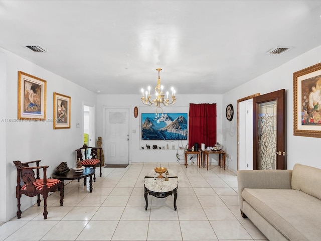 living room featuring an inviting chandelier and light tile patterned floors