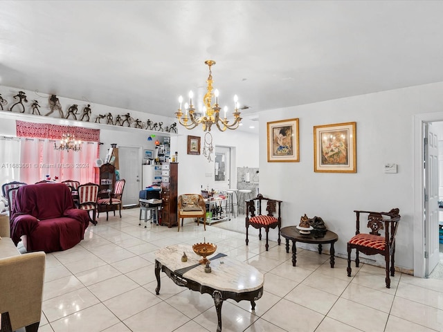 living room featuring a notable chandelier and light tile patterned floors