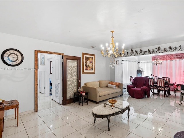 living room featuring an inviting chandelier and light tile patterned floors