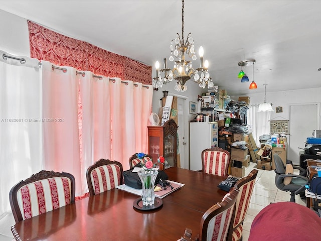 dining room featuring light tile patterned floors and an inviting chandelier