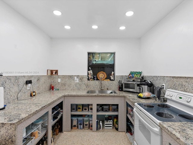 kitchen with sink, white range with electric stovetop, light stone countertops, and tasteful backsplash