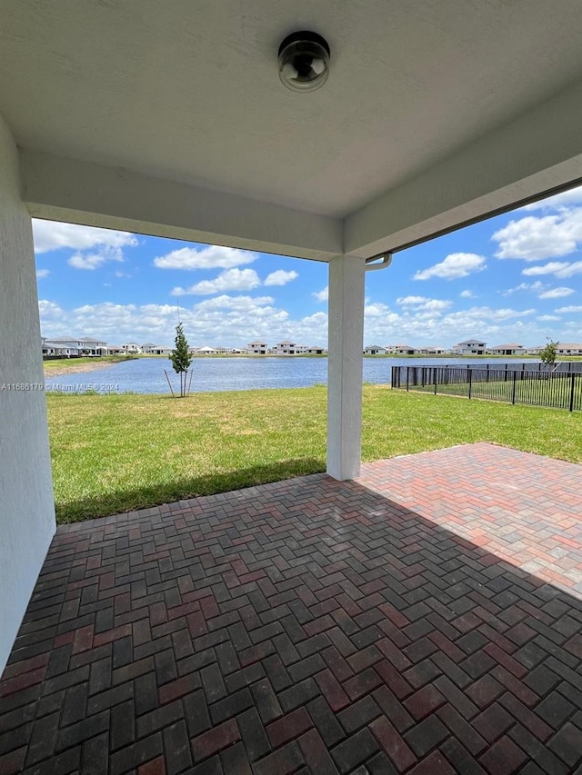 view of patio featuring a water view