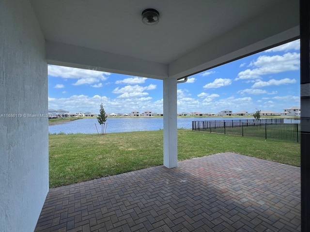 view of patio with a water view