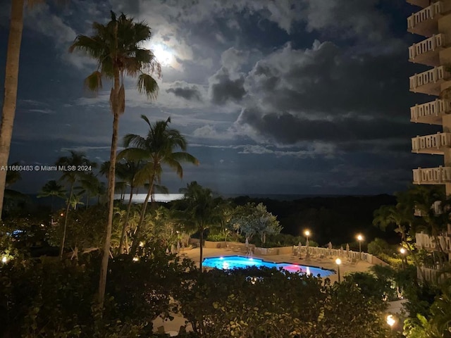 view of pool at night