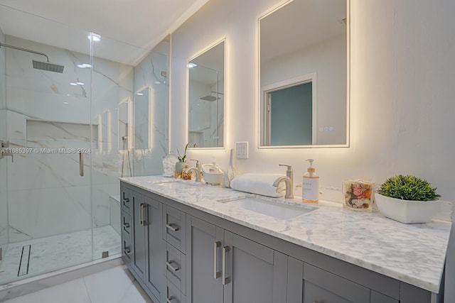 bathroom with a shower with door and vanity