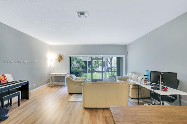 living room with light hardwood / wood-style floors