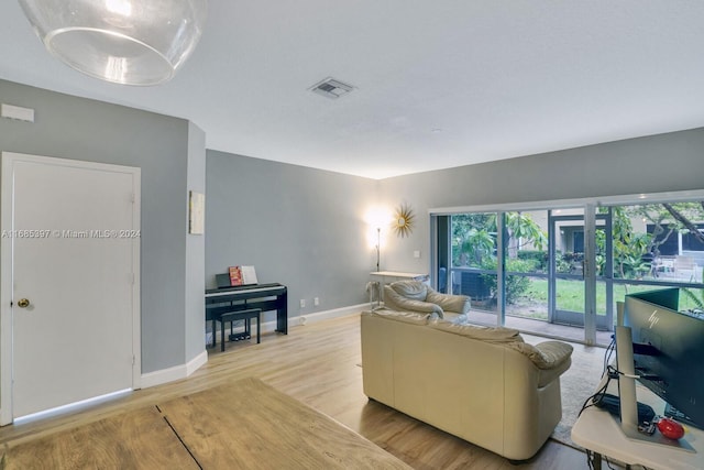 living room with light hardwood / wood-style floors