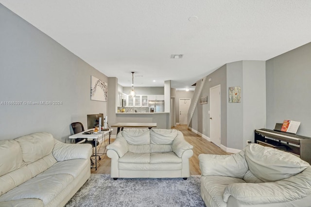 living room with light hardwood / wood-style flooring