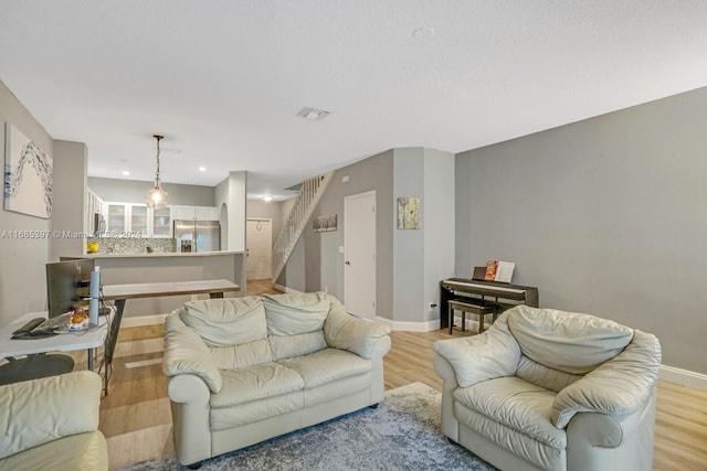 living room with light hardwood / wood-style flooring