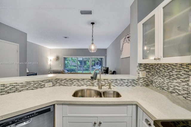 kitchen with white cabinetry, sink, and dishwasher