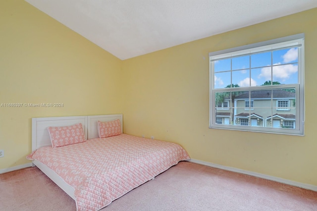 bedroom featuring light carpet