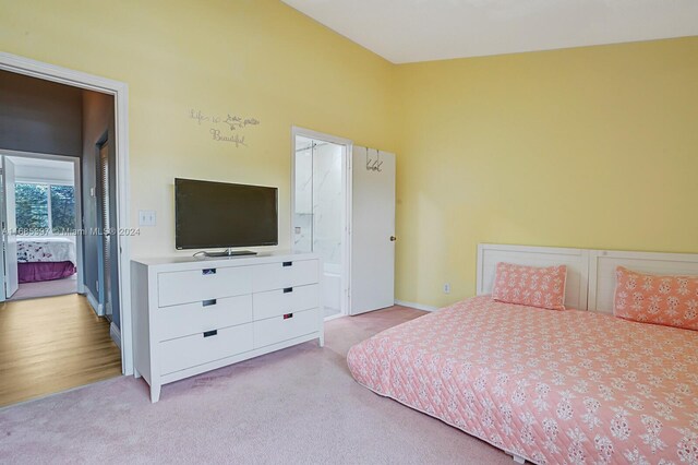 bedroom with light carpet