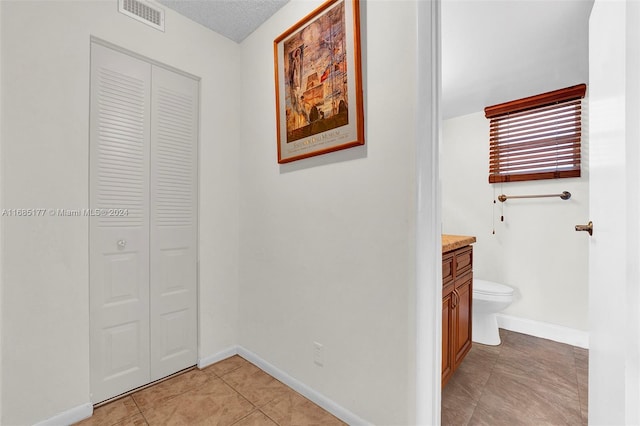 410 SE 2nd St Unit 220, Hallandale Beach, FL 33009 - corridor with baseboards, visible vents, and light tile patterned floors