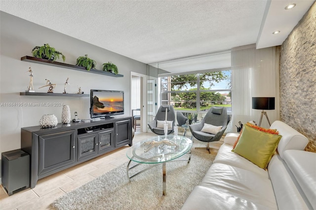 tiled living room with a textured ceiling