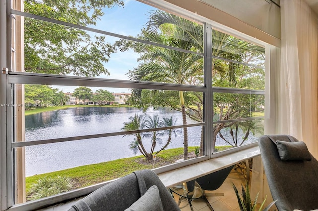 sunroom with a water view and plenty of natural light