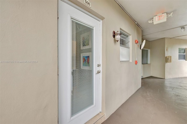 hall with light tile patterned flooring