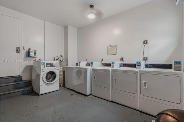 community laundry room with washing machine and clothes dryer