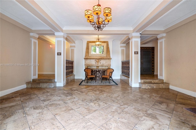 hallway featuring ornamental molding, decorative columns, and a notable chandelier