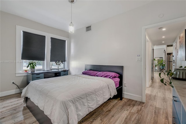 bedroom featuring light wood-type flooring