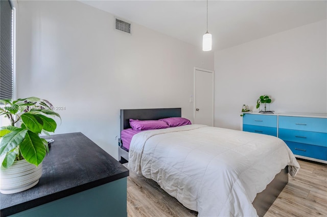 bedroom with light hardwood / wood-style flooring