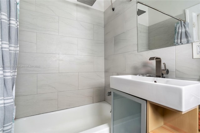 bathroom with backsplash, vanity, and shower / tub combo with curtain