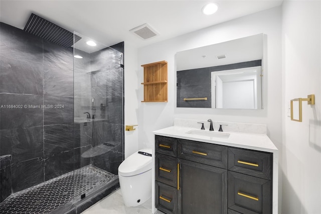 bathroom with vanity, toilet, and a shower with door