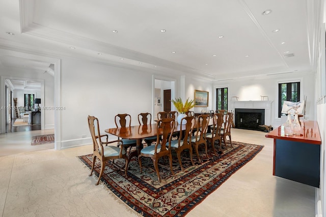 dining room with ornamental molding and a tray ceiling