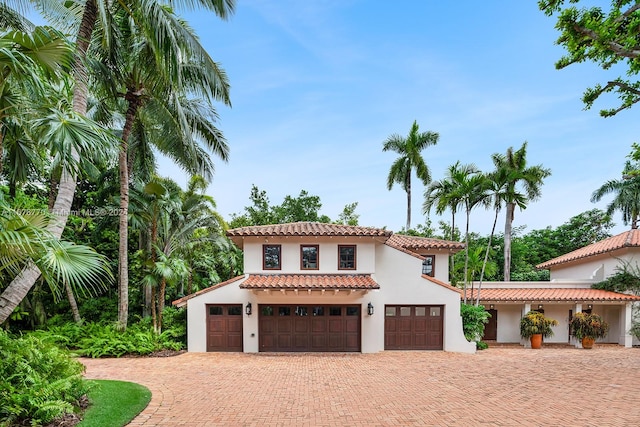 mediterranean / spanish-style house featuring a garage