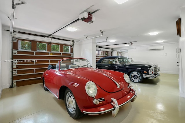 garage with a garage door opener and an AC wall unit