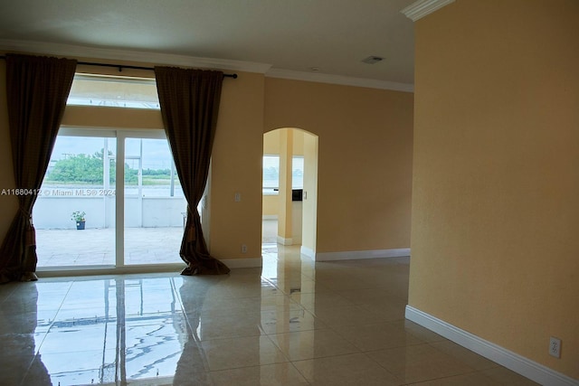 1380 Meadows Blvd, Weston, FL 33327 - unfurnished room with arched walkways, ornamental molding, and light tile patterned flooring
