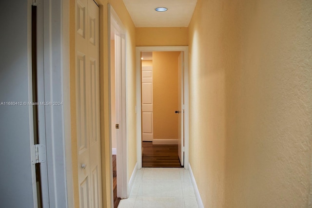 1380 Meadows Blvd, Weston, FL 33327 - hallway with light tile patterned floors and a textured wall