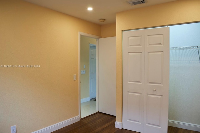 1380 Meadows Blvd, Weston, FL 33327 - unfurnished bedroom featuring dark wood finished floors, a closet, and recessed lighting