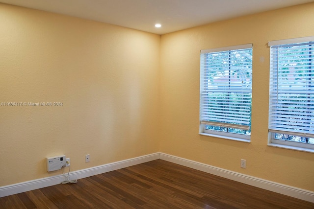 spare room featuring hardwood / wood-style flooring