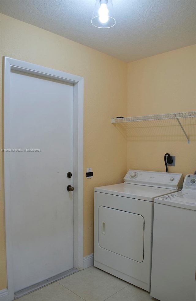 1380 Meadows Blvd, Weston, FL 33327 - laundry room with separate washer and dryer and light tile patterned floors