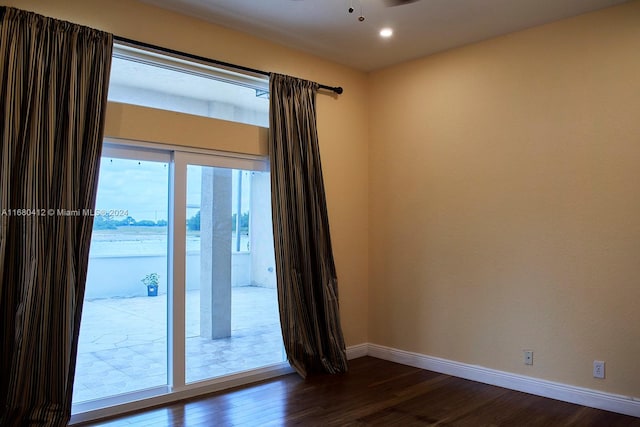 spare room with ceiling fan and hardwood / wood-style floors