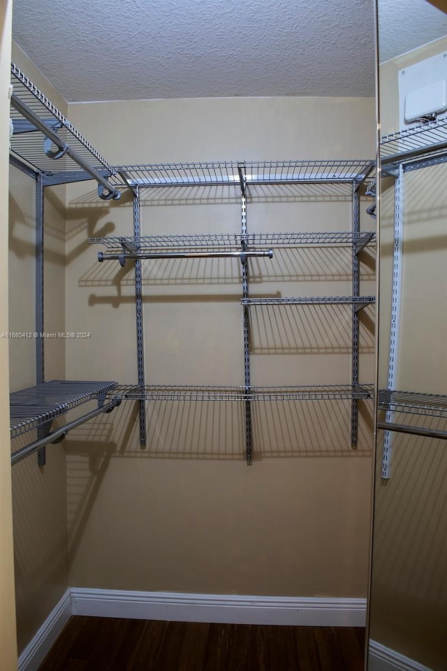 1380 Meadows Blvd, Weston, FL 33327 - walk in closet with wood finished floors