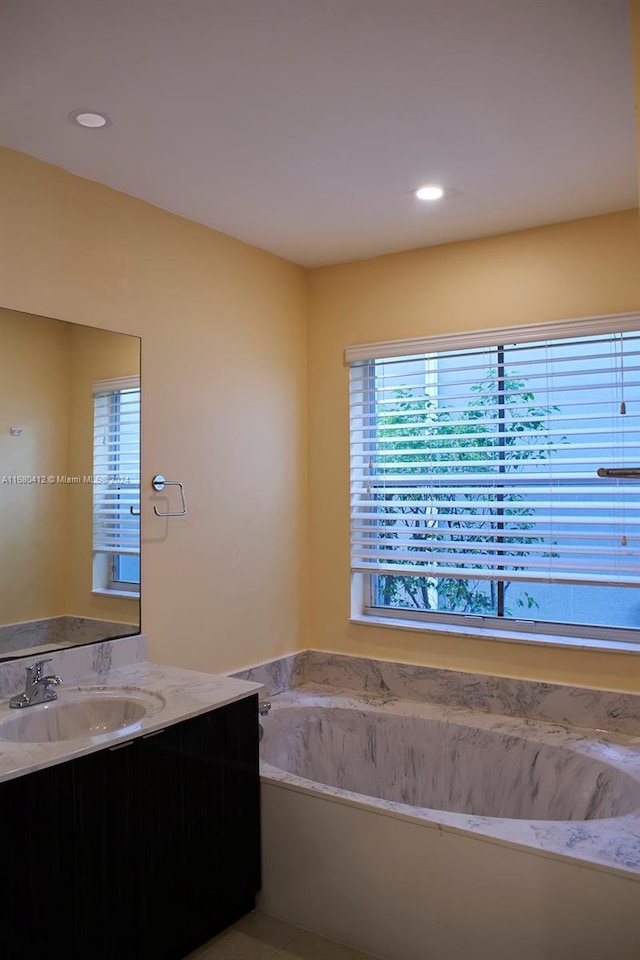 1380 Meadows Blvd, Weston, FL 33327 - full bathroom featuring vanity, healthy amount of natural light, a garden tub, and recessed lighting