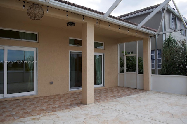 view of patio / terrace with a lanai