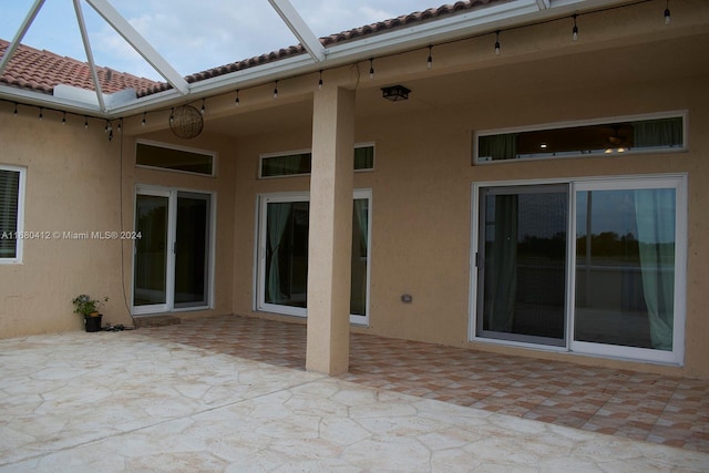 1380 Meadows Blvd, Weston, FL 33327 - view of patio / terrace featuring glass enclosure