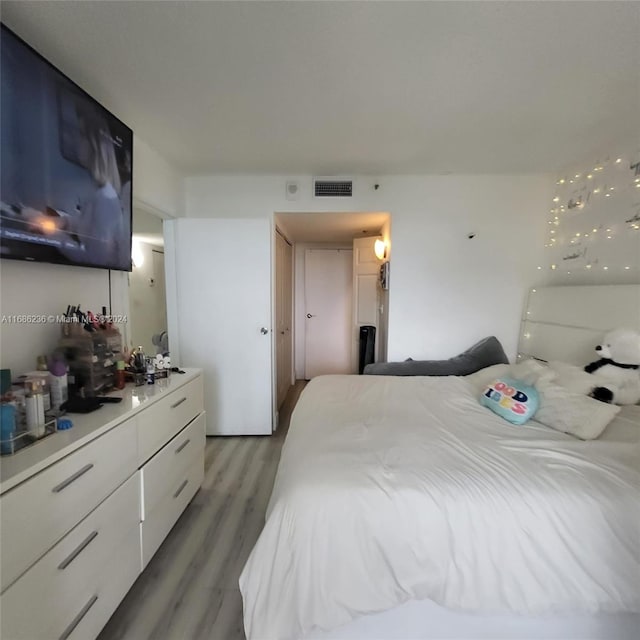 bedroom featuring hardwood / wood-style flooring