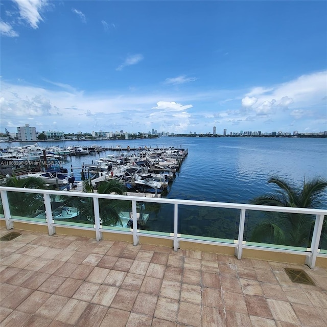 exterior space with a water view and a balcony