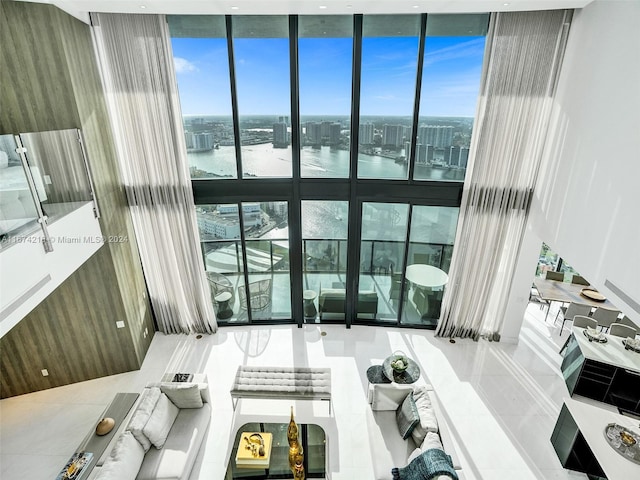 tiled living room with a water view