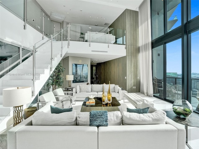 living room featuring a high ceiling and expansive windows