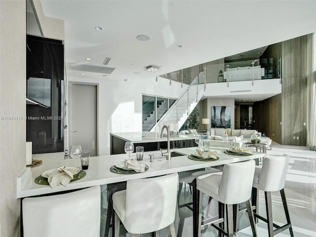 kitchen featuring a breakfast bar area and kitchen peninsula