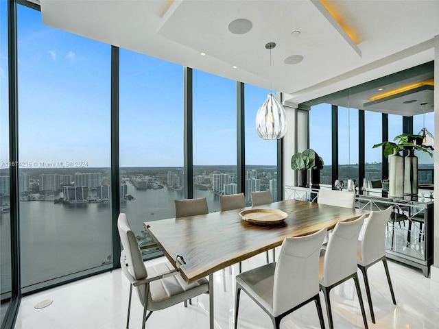 sunroom / solarium with a water view and a wealth of natural light