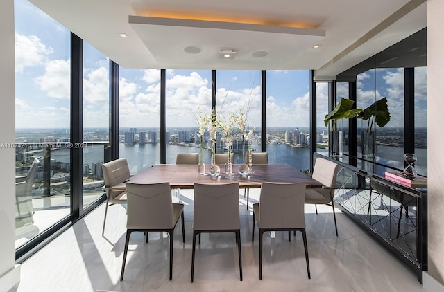 sunroom / solarium with a water view